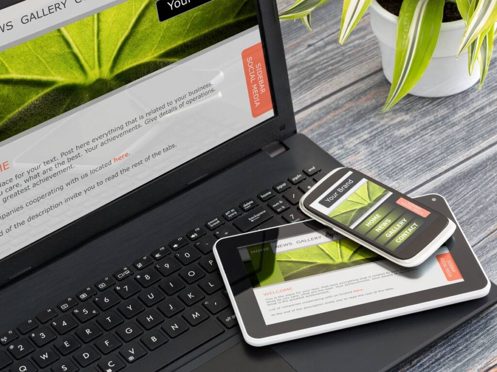 Businessman holding a tablet with futuristic digital icons and globe.