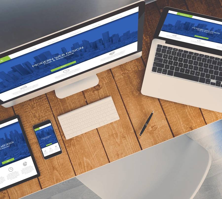 Businessman holding a tablet with futuristic digital icons and globe.